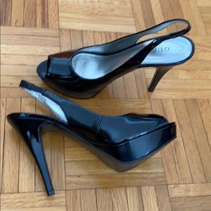 Guess black platform pumps open toe slingback.